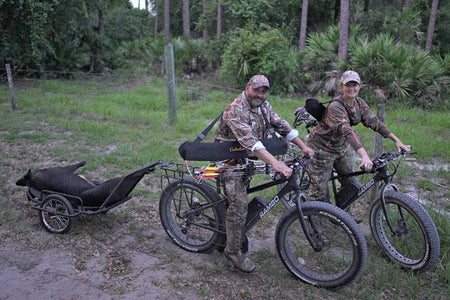 Hunters Coming From a Wild Bore Hunting Trip on Their Rambo Bikes With a Game Trailer in Tow